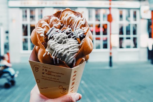 Indulge in a delectable bubble waffle ice cream cone, a taste of London's summer sweets.