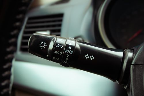 Free Detailed image of car indicator lever showing light and wiper controls on a steering column inside a vehicle. Stock Photo
