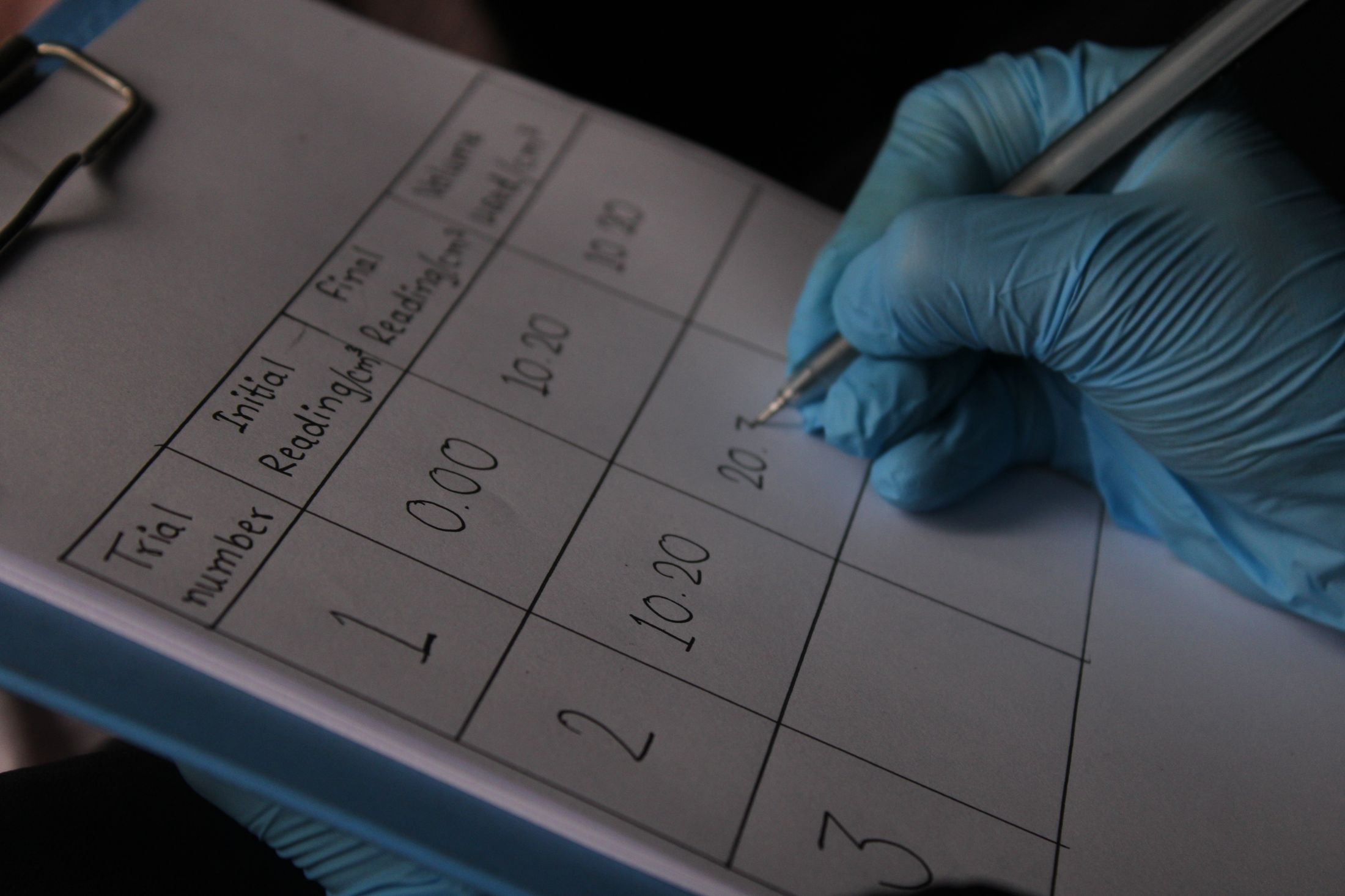 Context photograph: Scientist documenting experimental data. Not a VIEWPIECE acquisition or analysis.