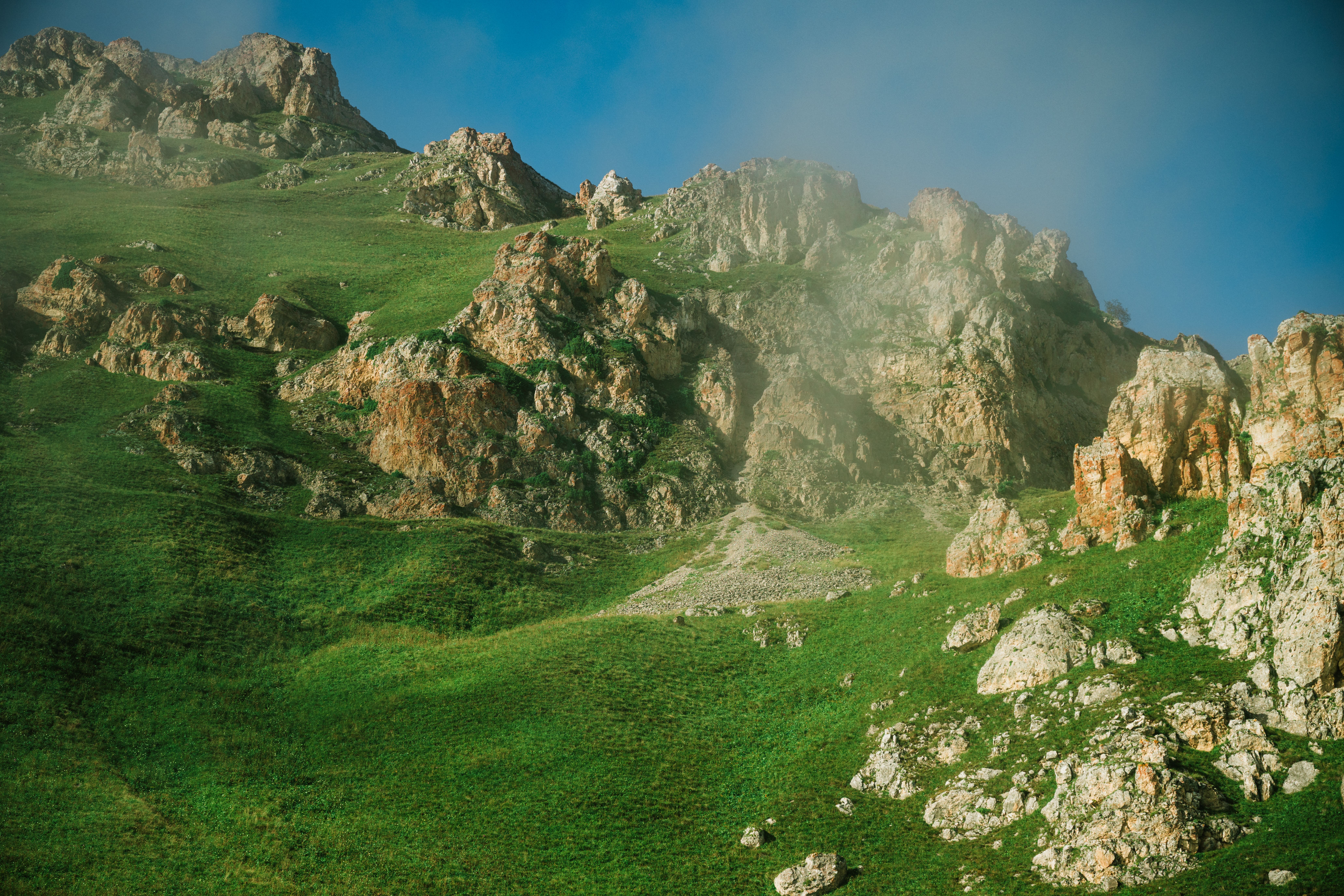 Breathtaking view of a lush, green mountain landscape in Chechnya during spring.