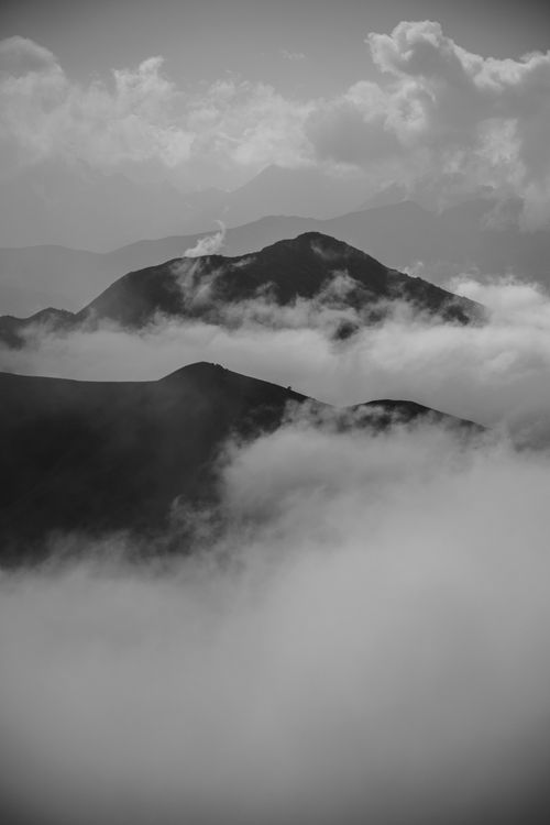 Free Dramatic black and white view of misty mountain peaks in Chechnya, Russia. Stock Photo
