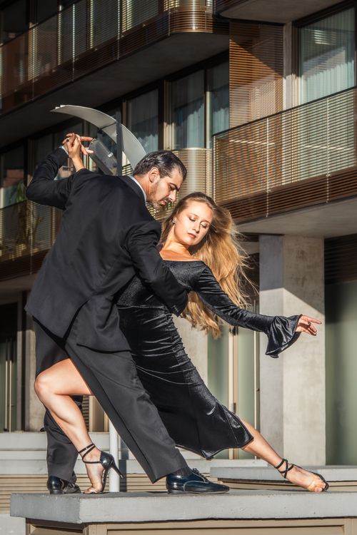 Free A couple elegantly performing a tango dance in Buenos Aires, Argentina, showcasing grace and passion in urban setting. Stock Photo