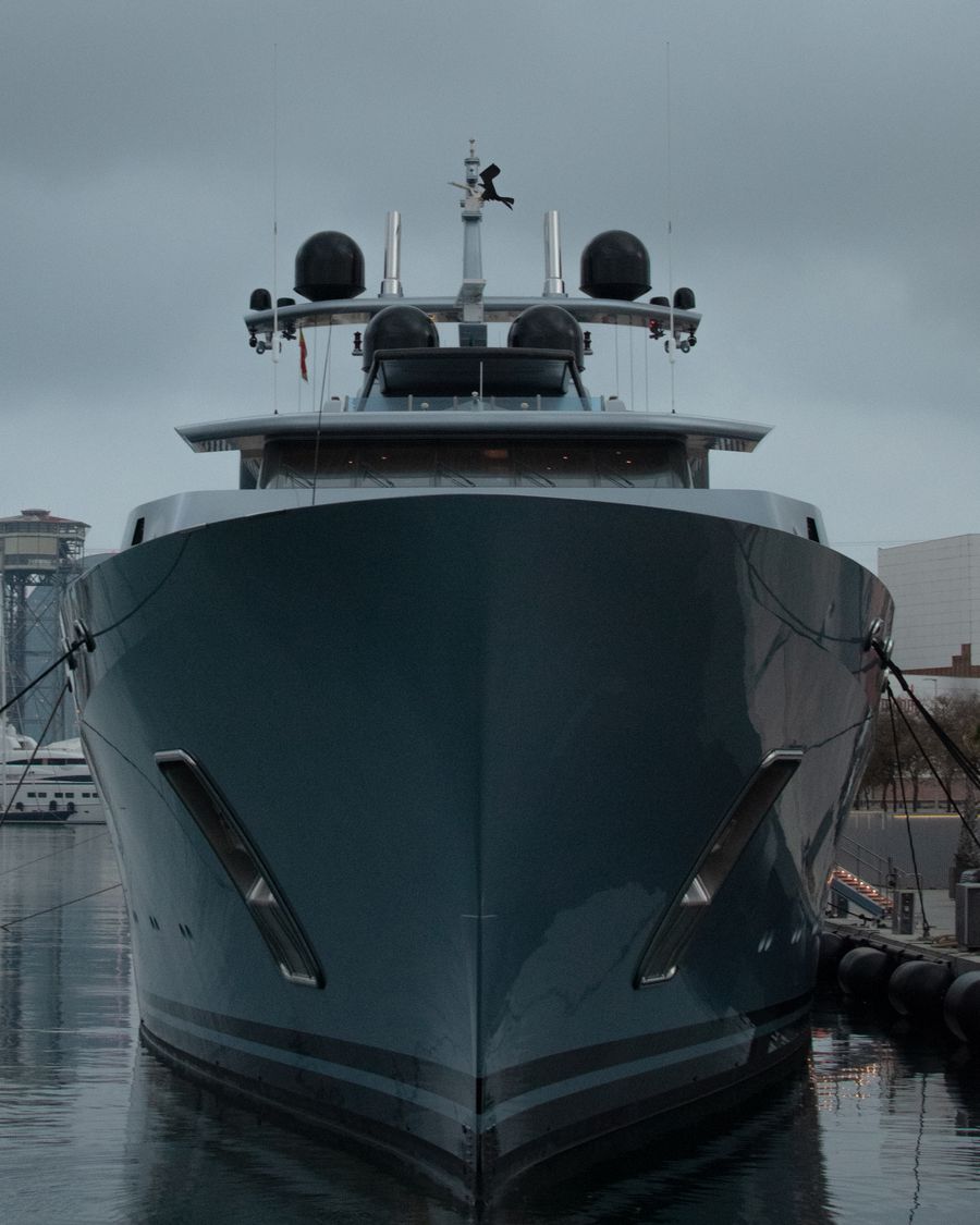 Dark bow of the 50-metre superyacht moored before delivery