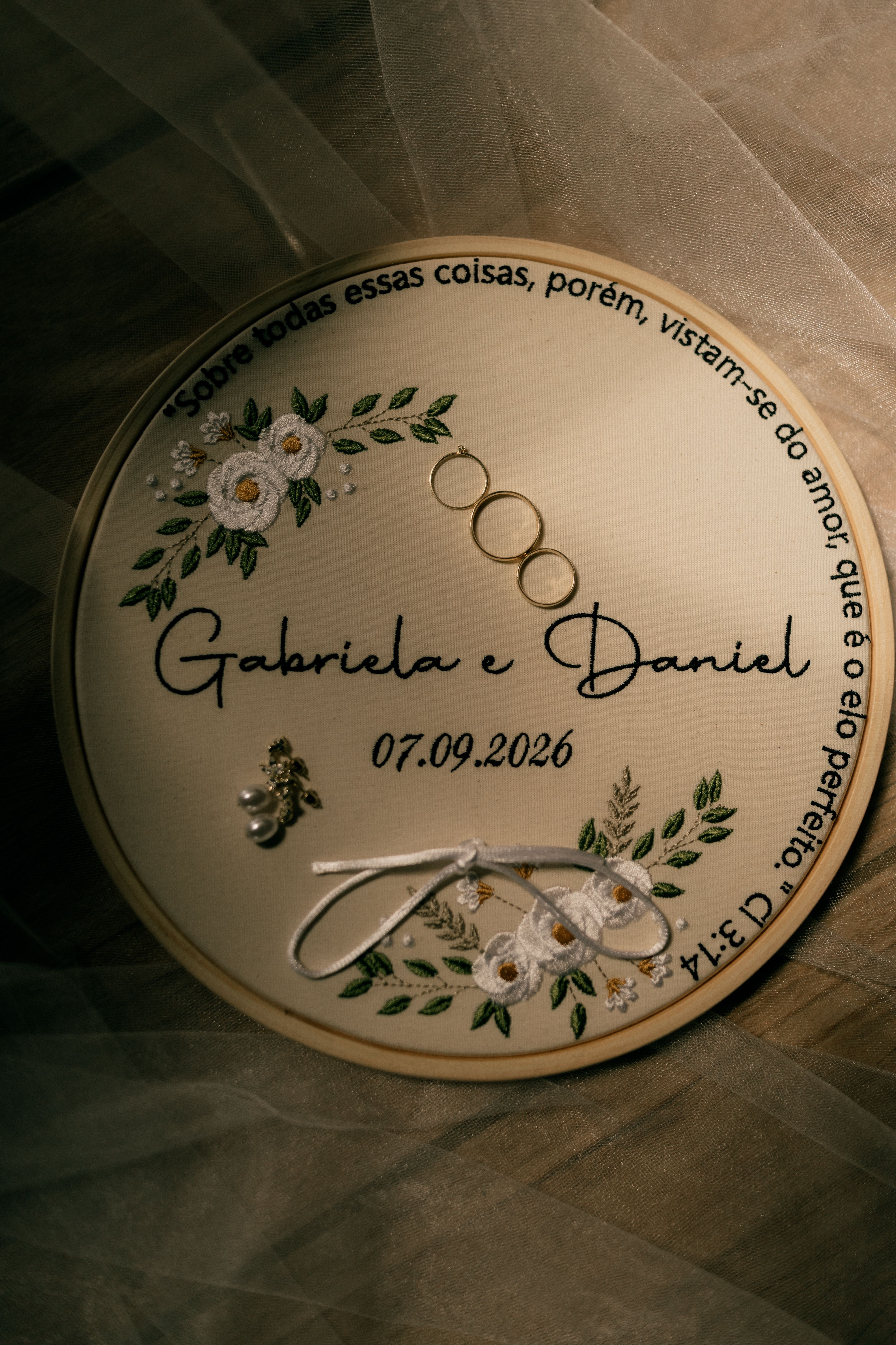 Beautiful wedding ring holder featuring rings and floral design, perfect for romantic ceremonies.