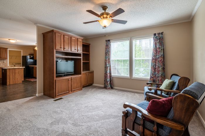 Happy family enjoying their new custom-built entertainment center in their living room