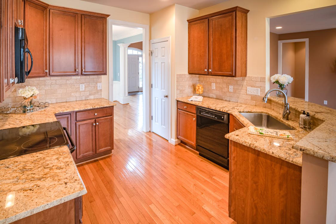 kitchen with green wall and brown cabinet