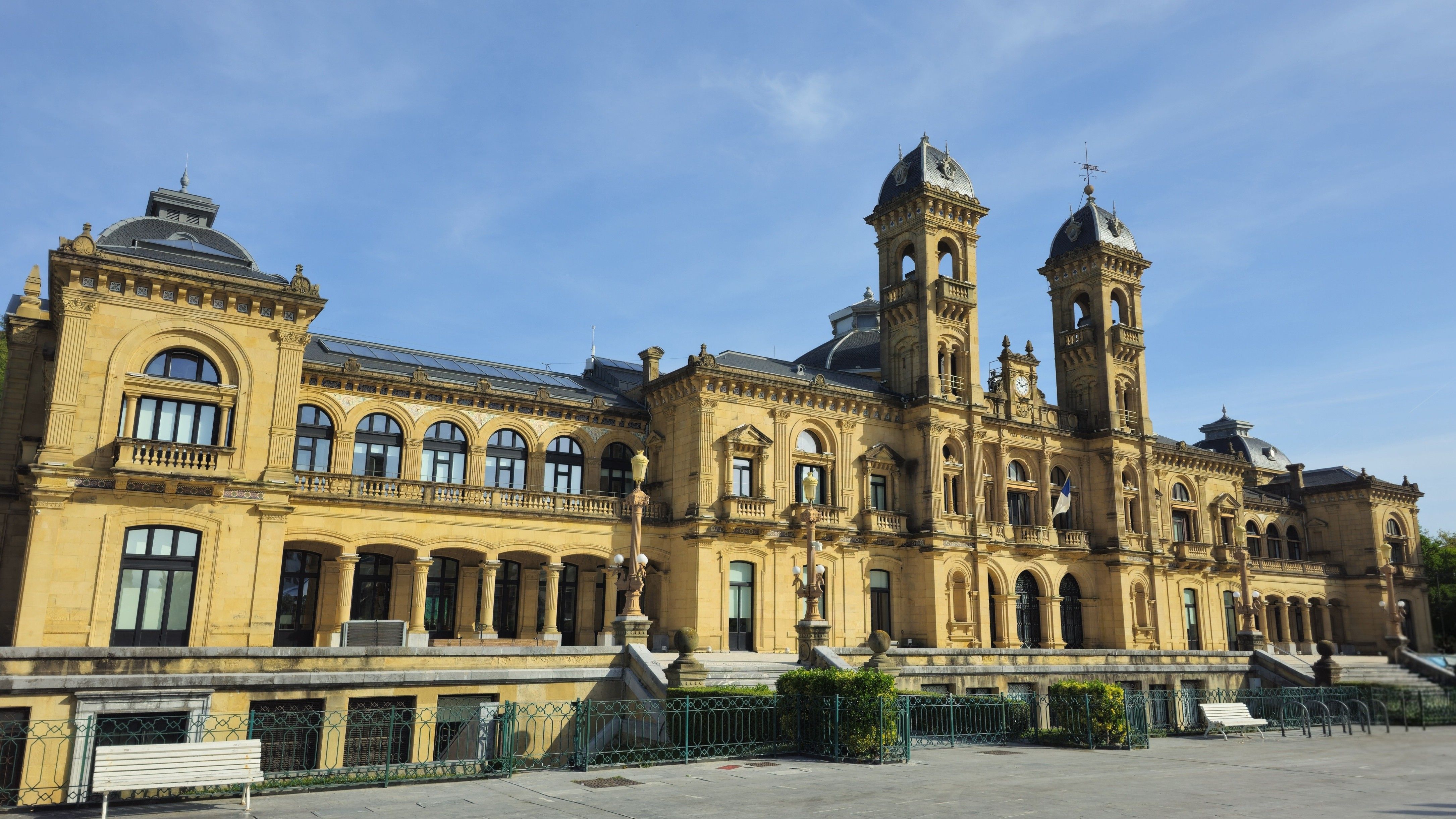 The majestic San Sebastián City Hall in Spain's Basque Country captured under clear blue skies.