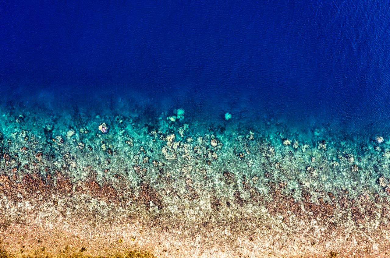 stunning aerial shot of jakarta s coastline showcasing vivid ocean col