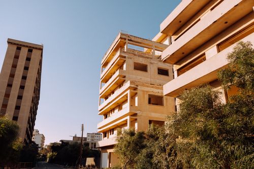 Free Abandoned urban area with modern architectural style under clear blue skies. Stock Photo