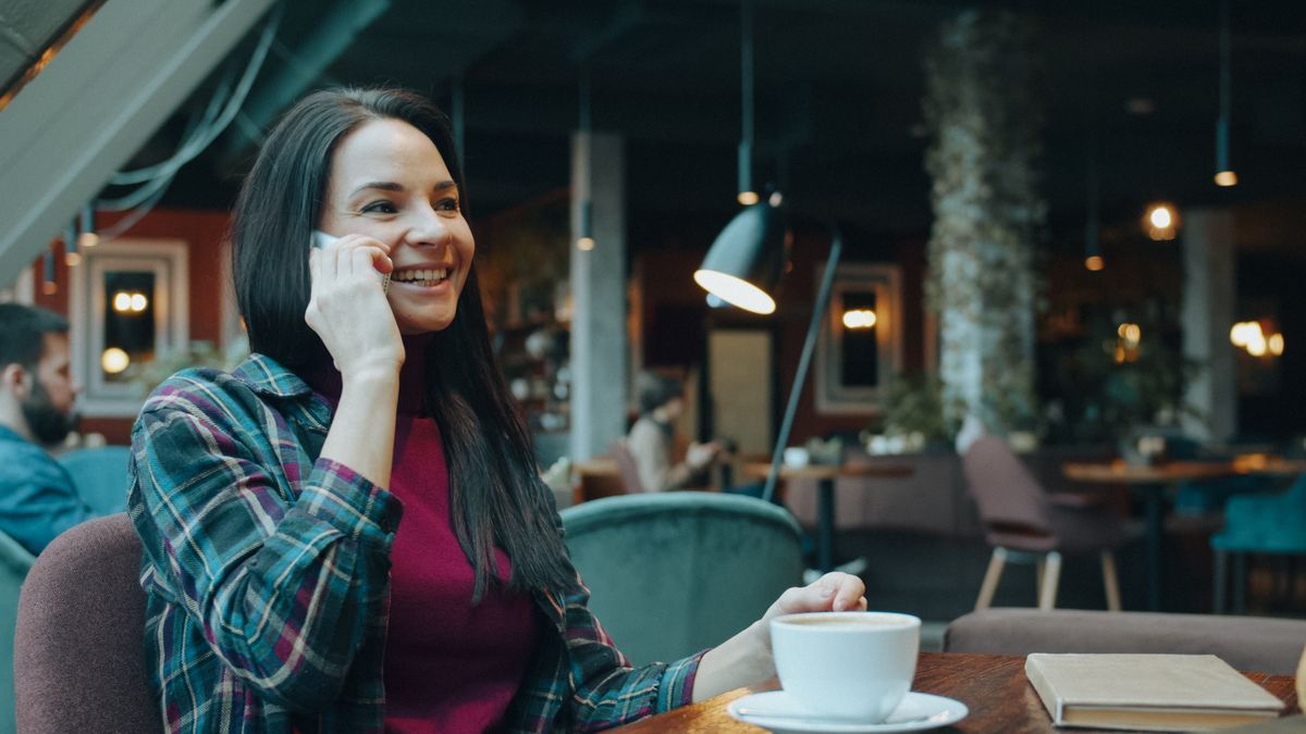 Woman enjoying coffee in a modern café