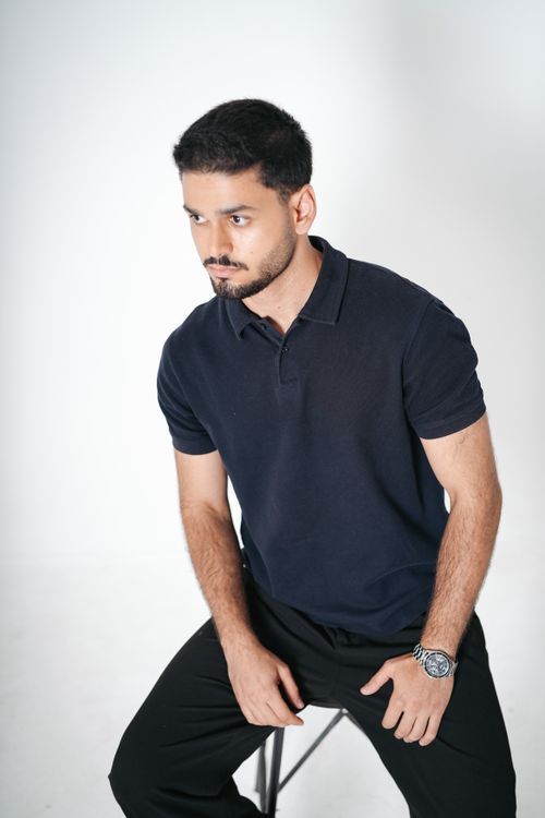 Free Studio portrait of a confident male model in casual attire with a white background. Stock Photo