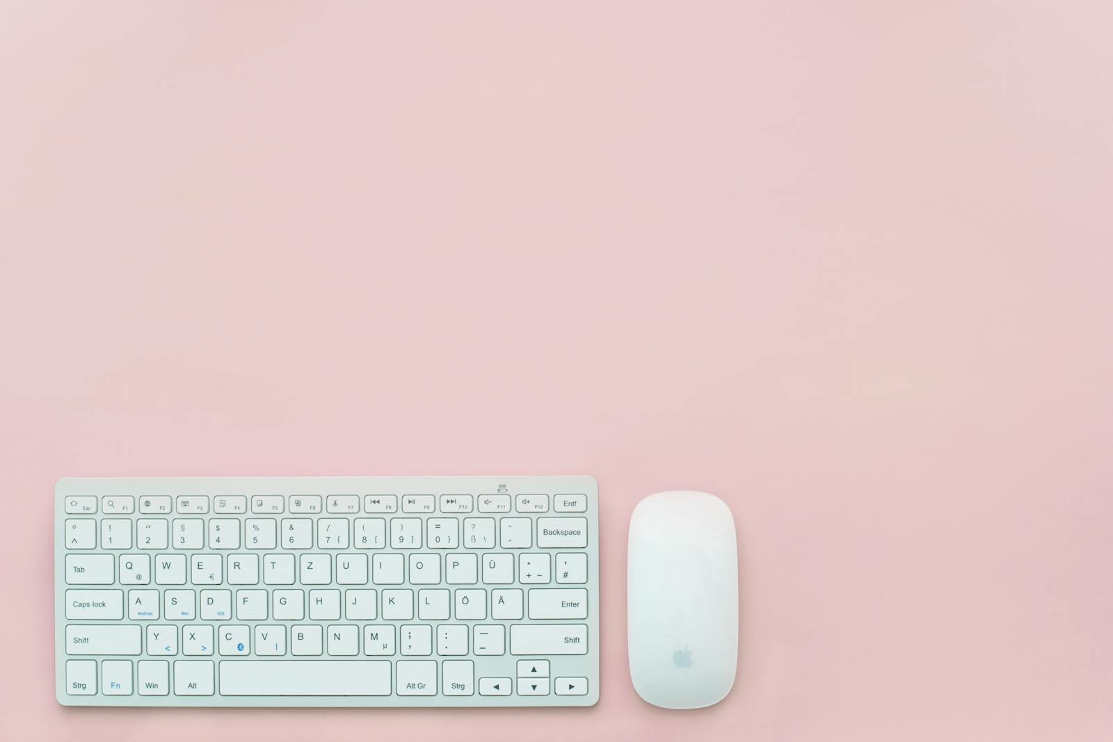 Aerial view of a full-size synthetic soccer pitch with centre circle and penalty boxes