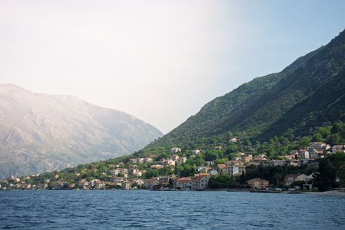 Free Idyllic view of Kotor Bay with picturesque mountains and coastal town in Montenegro. Stock Photo