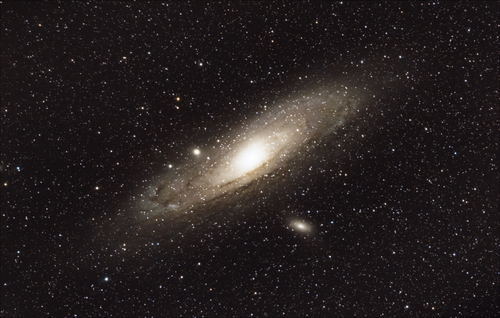 Free Stunning capture of the Andromeda Galaxy showcasing stars and cosmic beauty. Stock Photo