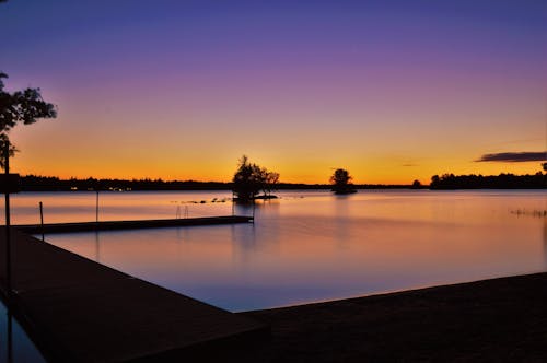 Fotografía De Silueta De Sea Dock Durante La Puesta De Sol