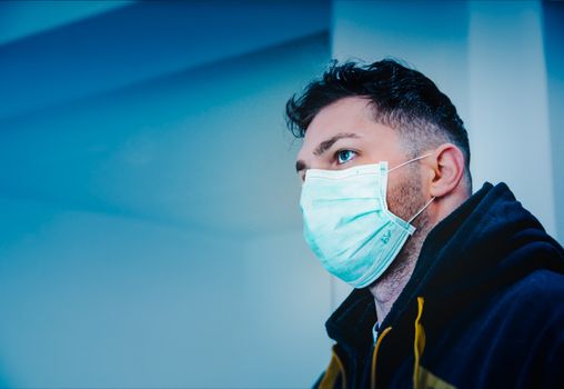 Man in Black and Yellow Jacket With Face Mask