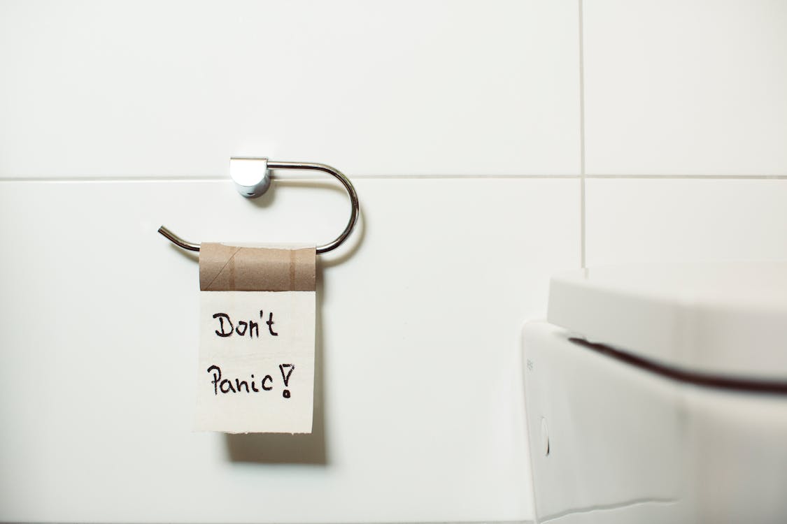 Free Don't Panic Text on Toilet Paper Stock Photo