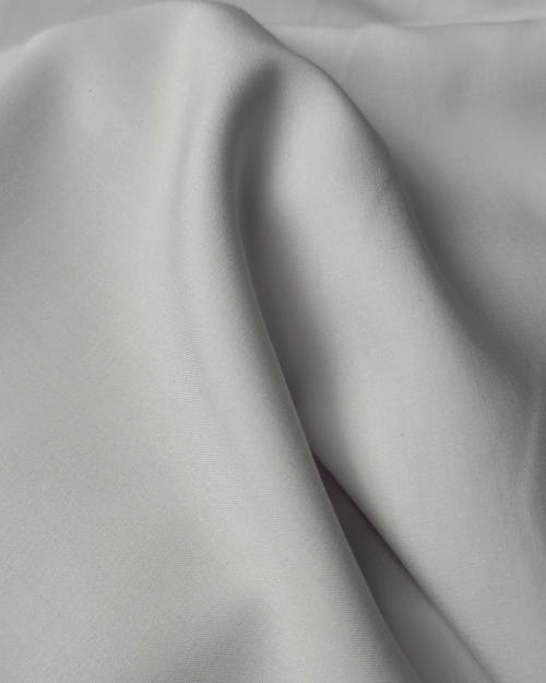 Free Detailed close-up of white fabric texture showcasing folds and softness. Stock Photo