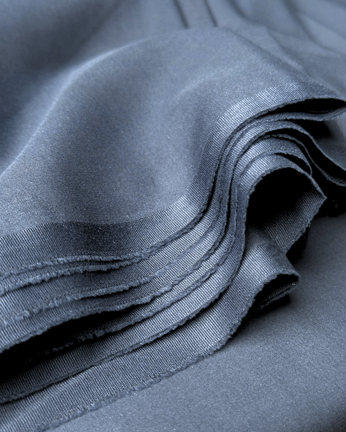 Free Detailed close-up of smooth blue fabric layers showcasing texture and folds. Stock Photo