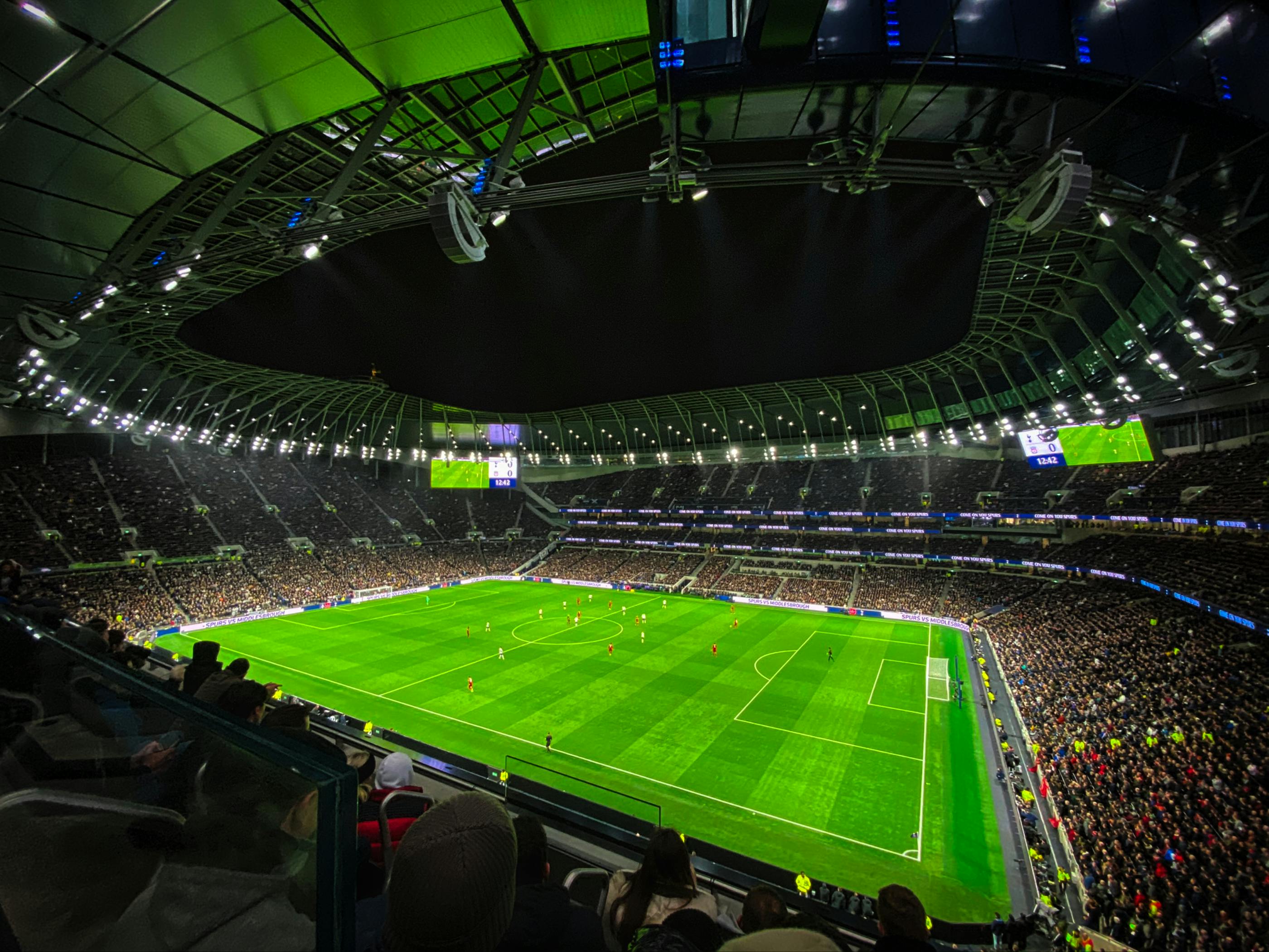 people sitting on stadium seats