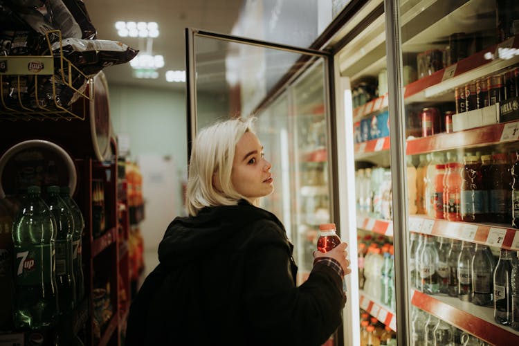 Woman Buying A Drink