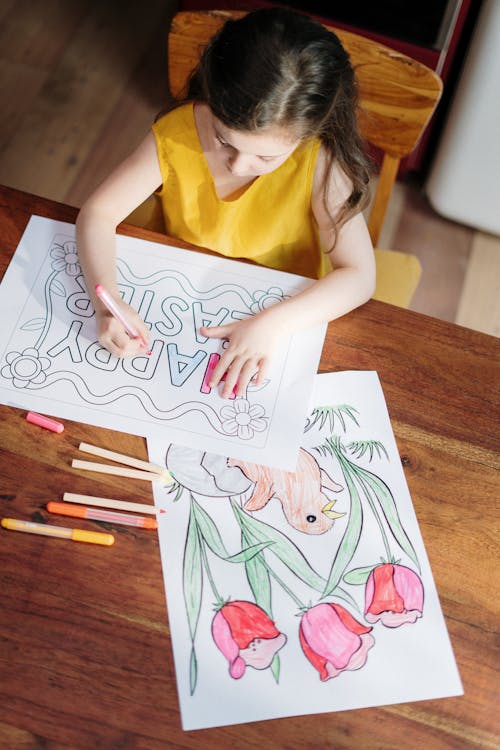 Girl in Yellow Tank Top Holding White Printer Paper