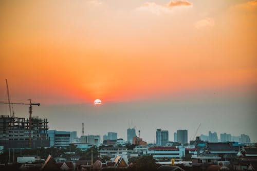 Free City Skyline during Orange Sunset Stock Photo