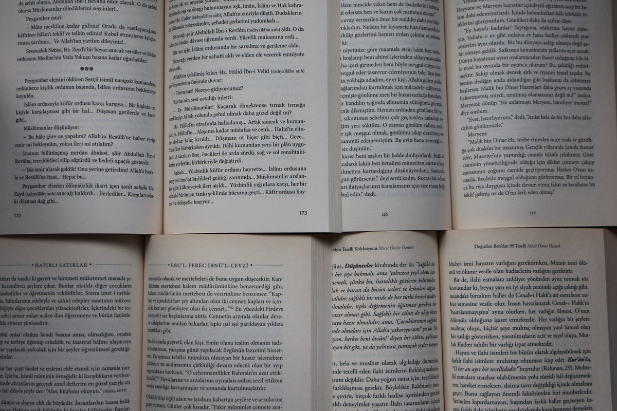Open books with Turkish text arranged neatly under natural light.