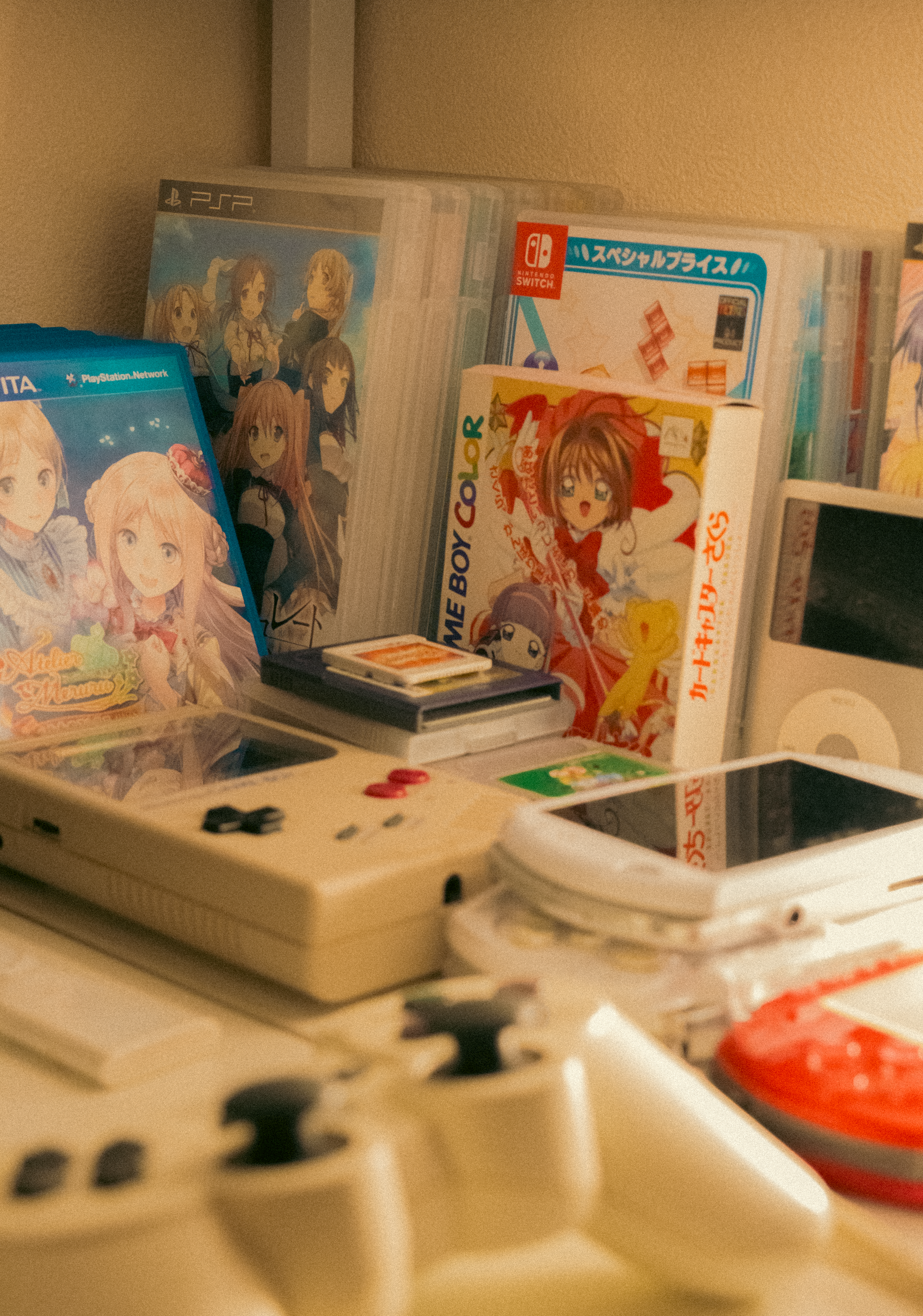 A nostalgic collection of retro gaming consoles and game cases on display.
