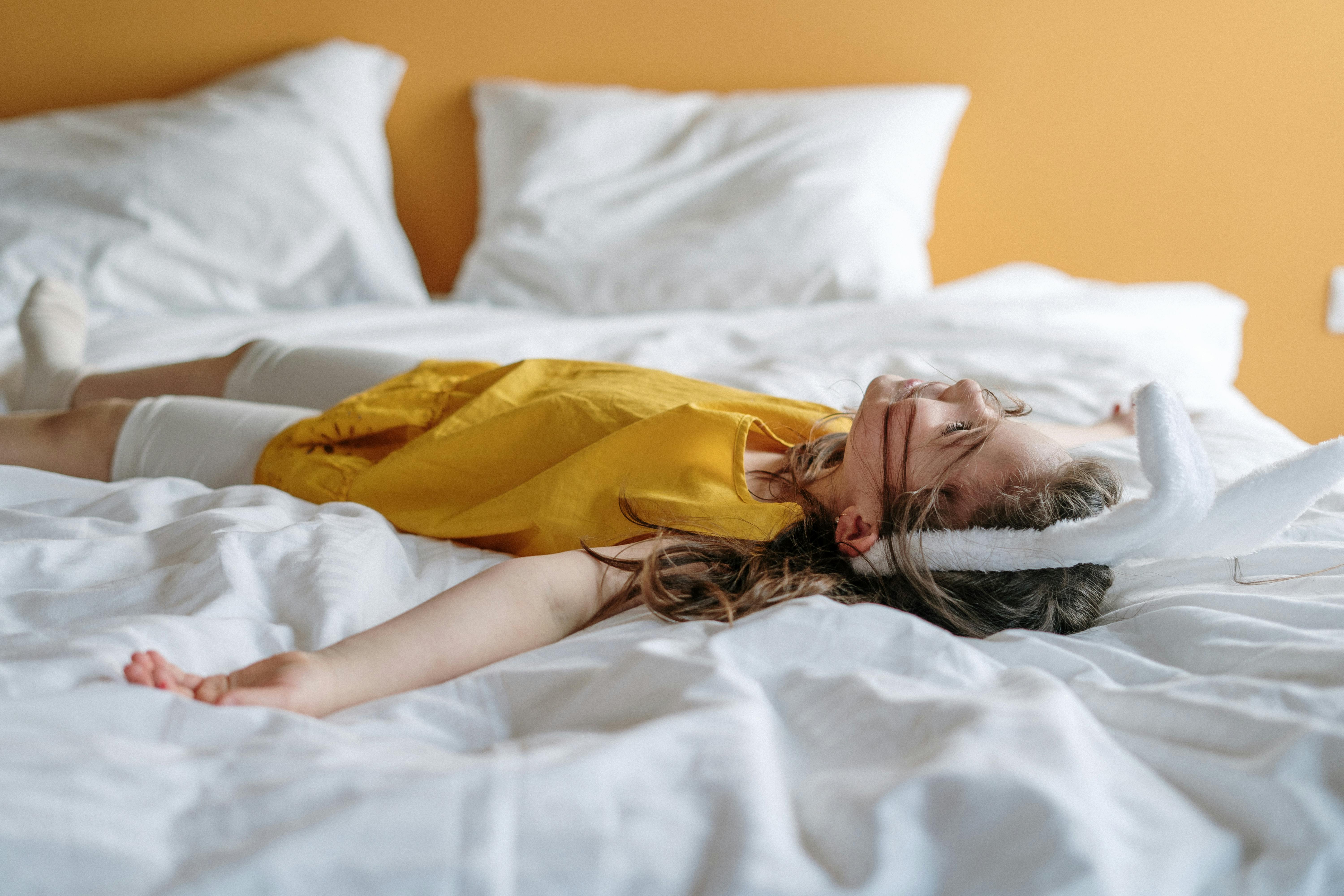 Download Girl In Yellow Dress Lying On Bed Free Stock Photo PSD Mockup Templates