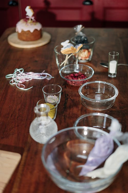 Clear Drinking Glasses on Brown Wooden Table