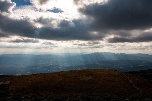 Free Sunrays piercing through clouds over the scenic Beskid Mountains, Poland. Stock Photo