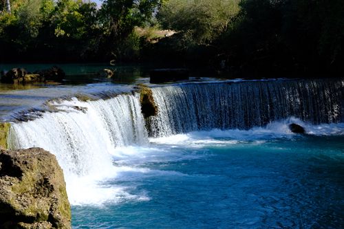 Free Beautiful waterfall scene at Manavgat, Side, Antalya, Türkiye, showcasing cascading waters in a lush setting. Stock Photo