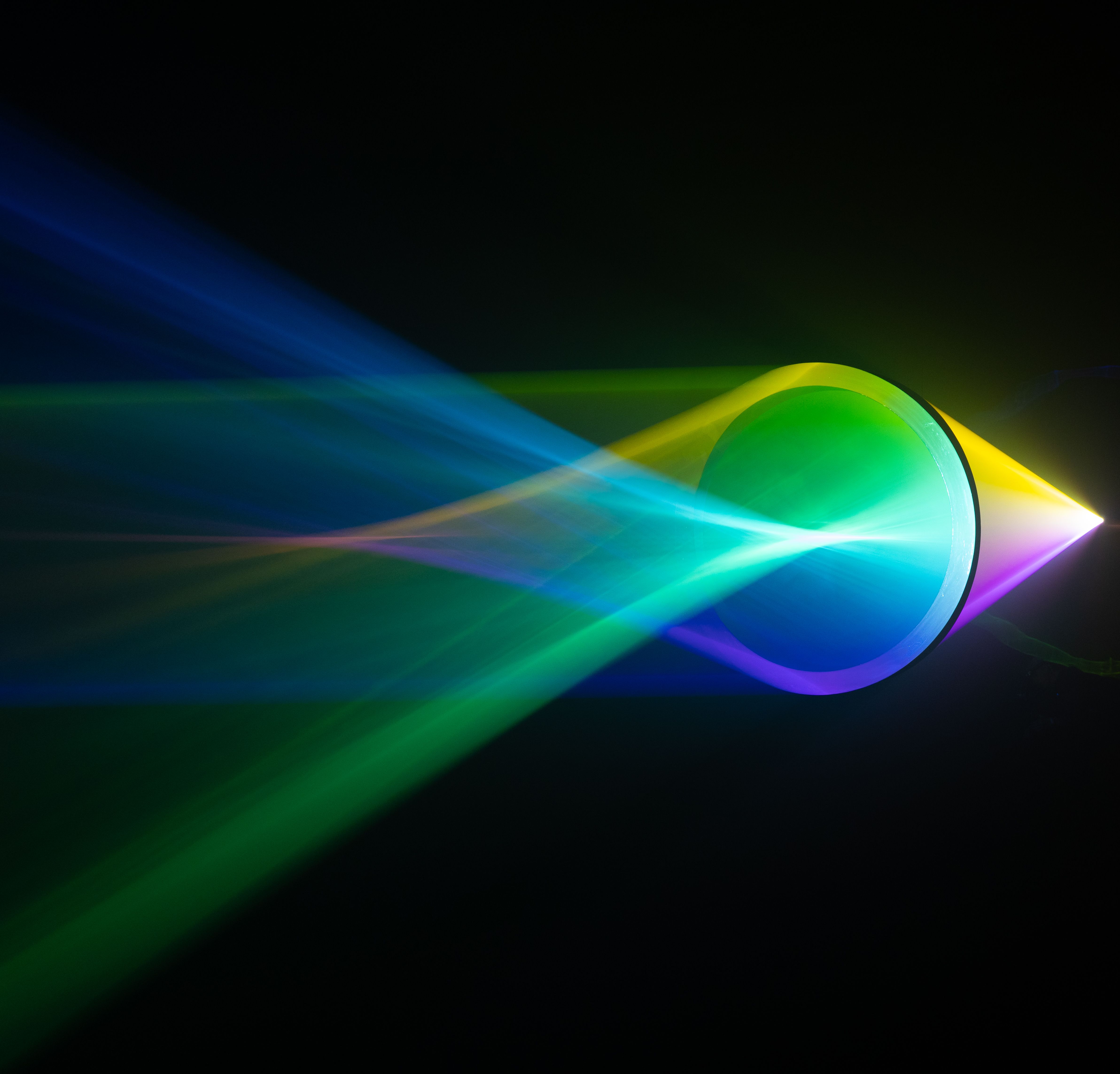 Vibrant light spectrum refracted through a prism, showcasing brilliant colors.