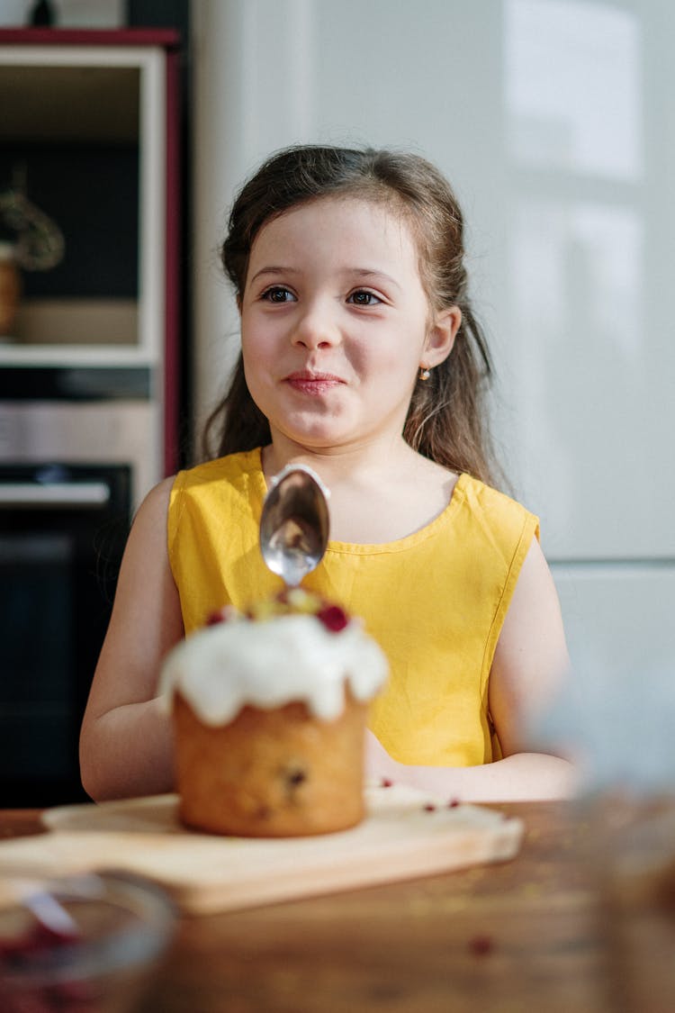 Girl In Yellow Tank Top Holding Spoon