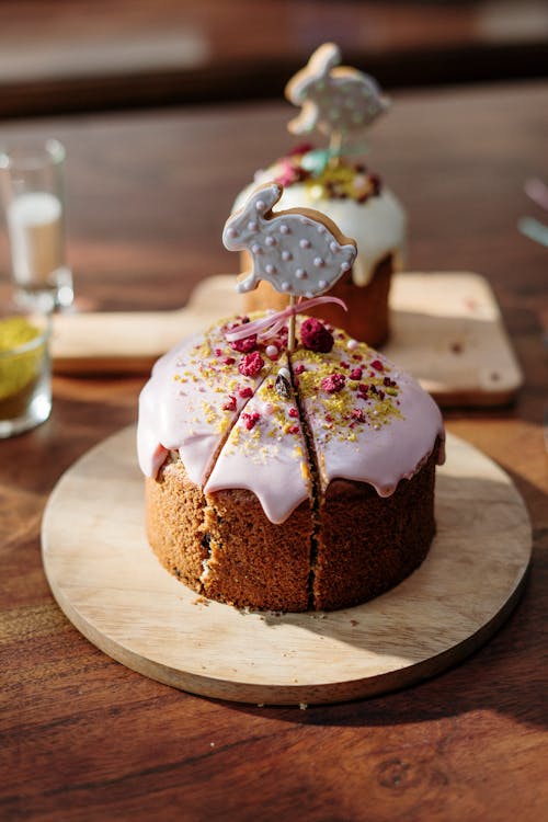 Cake with Bunny Topper on Brown Wooden Round Plate