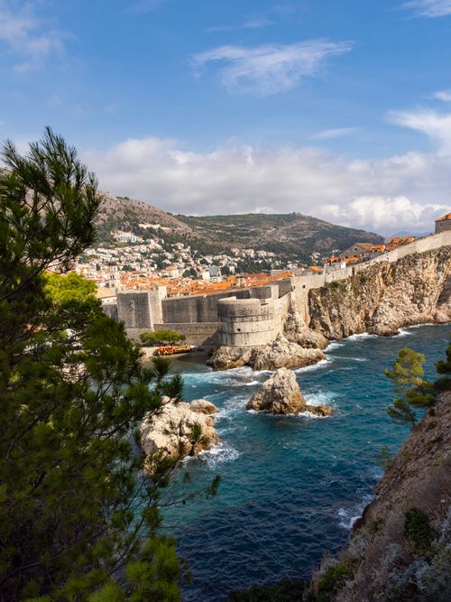 Free Explore the breathtaking landscape of Dubrovnik's medieval walls and the Adriatic Sea. Stock Photo