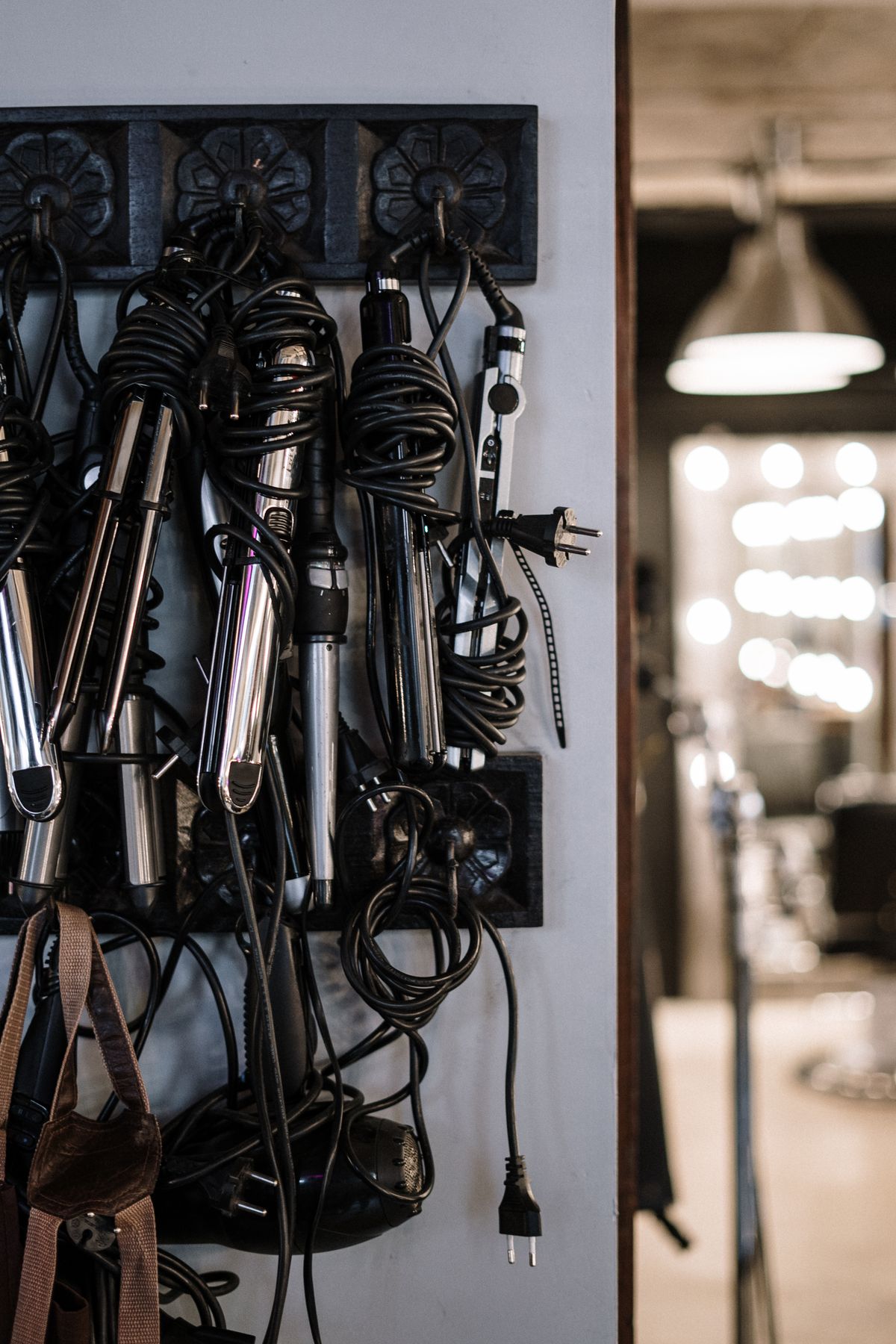 Professional hair styling tools including heated styling devices arranged in a salon