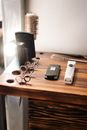 Silver Iphone 6 Beside Silver Watch and Black Iphone 5 on Brown Wooden Table