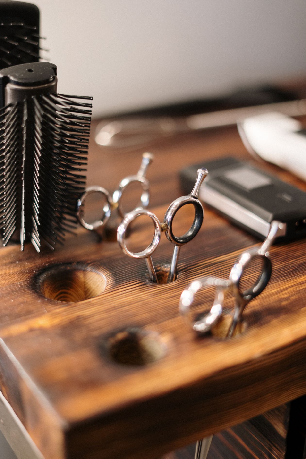 Man examining hairline in mirror