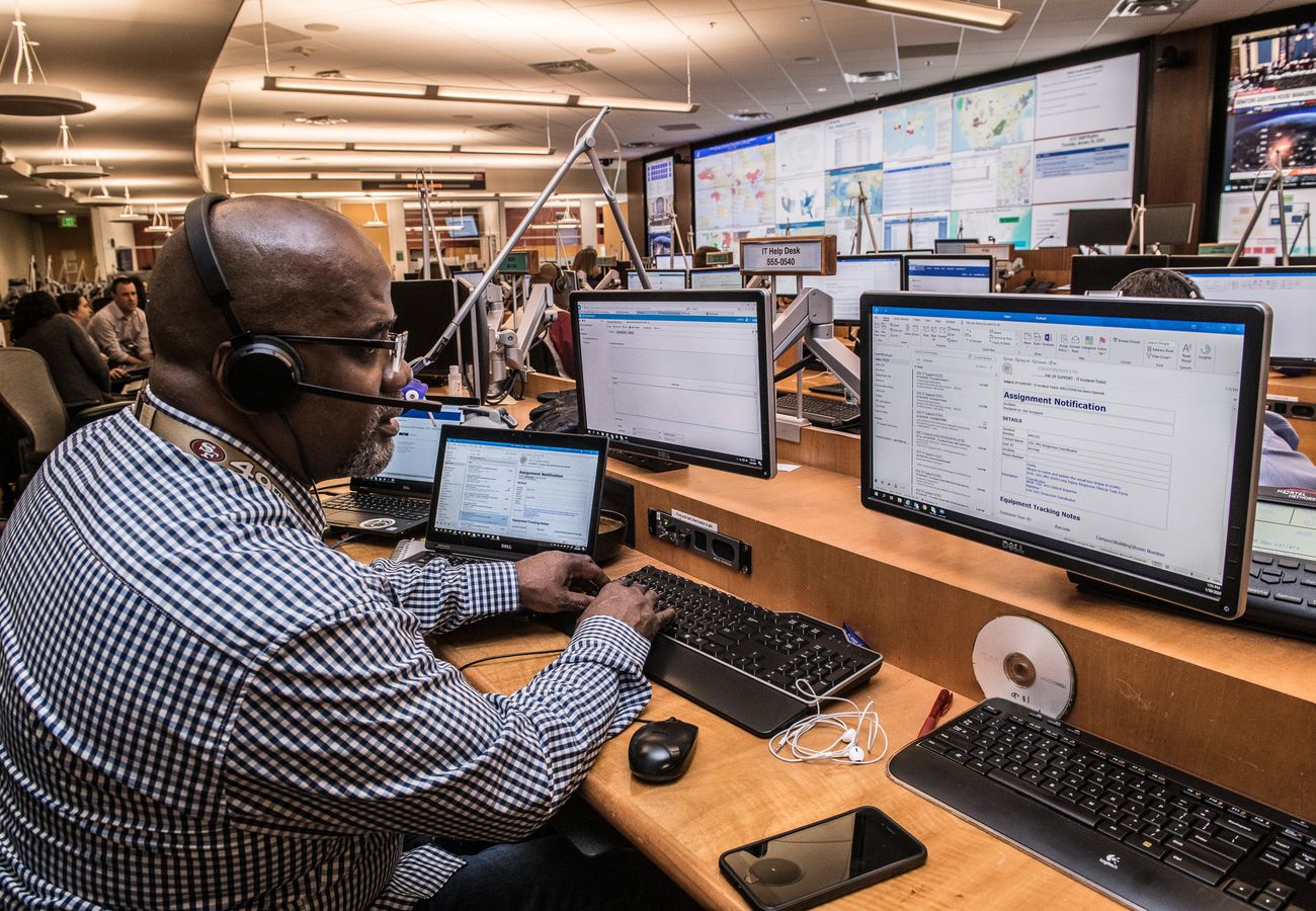 An operator watching data dashboards