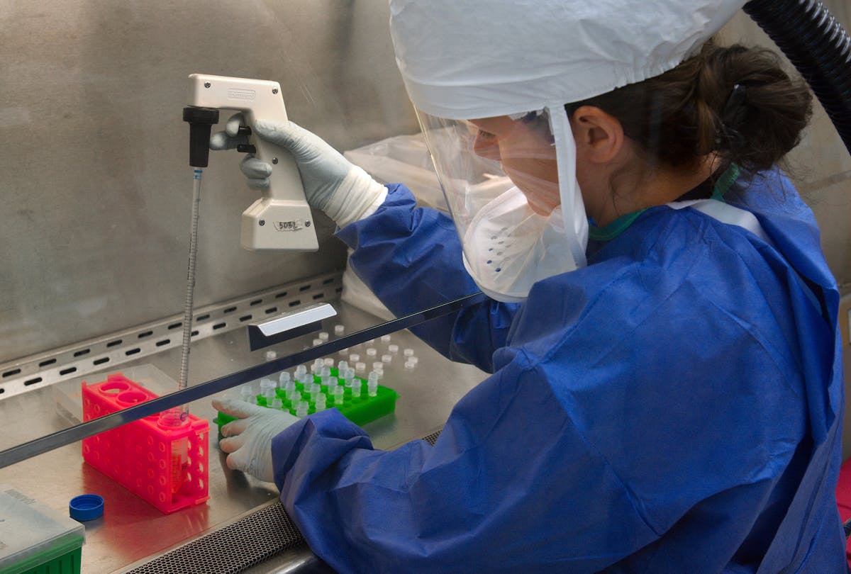 Healthcare professional preparing a vaccine in a clinical setting