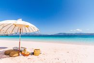 White and Brown Umbrella on Beach