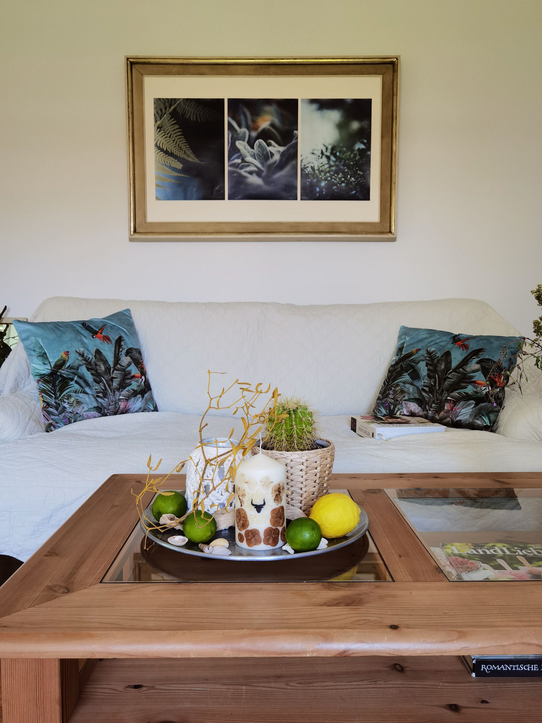 Natural living room with warm-toned cushions, fruit and understated seasonal details