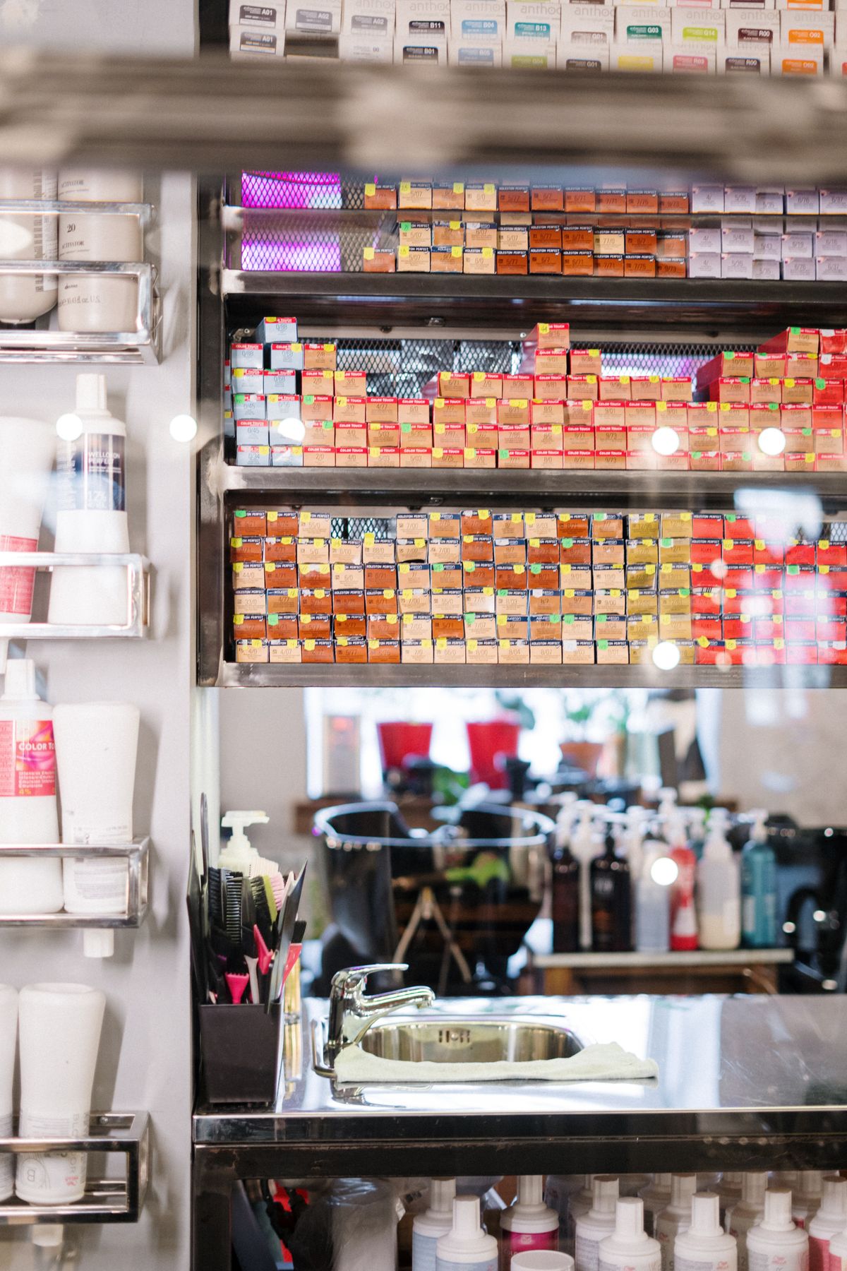 Salon assistant at shampoo bowl