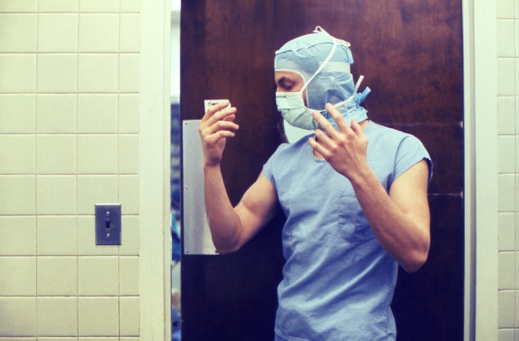 Man Preparing To Wear Protective Suit