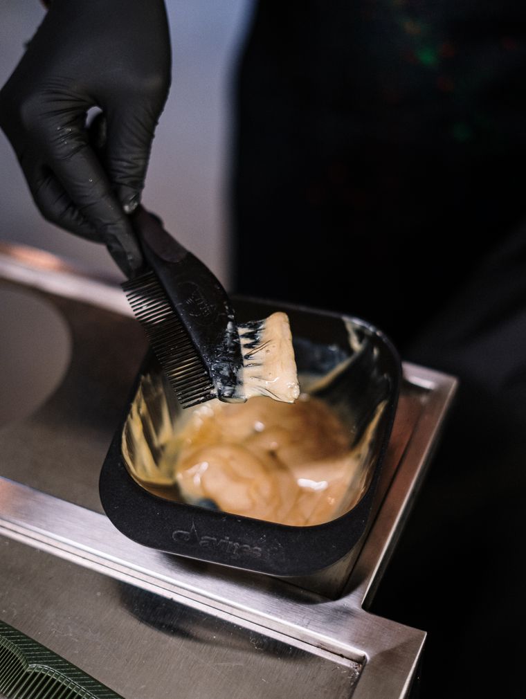 Comb with hair dye being applied