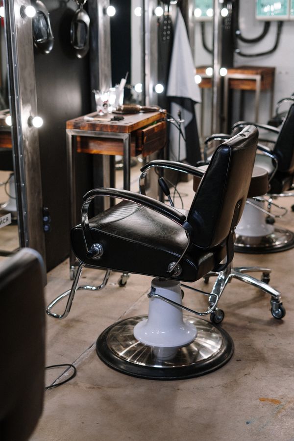Salon chair and mirror in a warm boutique studio