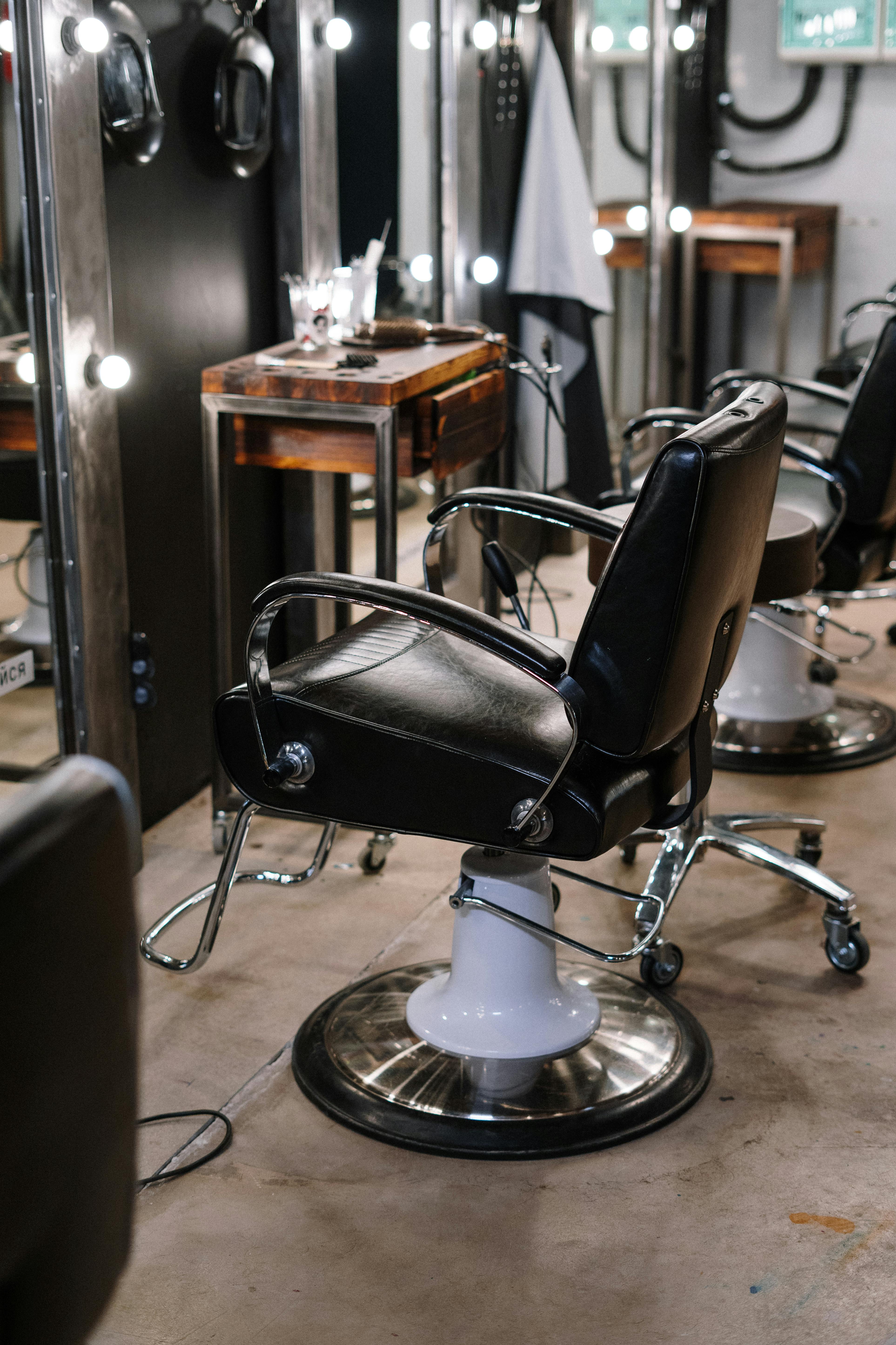 Black Leather Barber Chair in Front of Mirror · Free Stock Photo