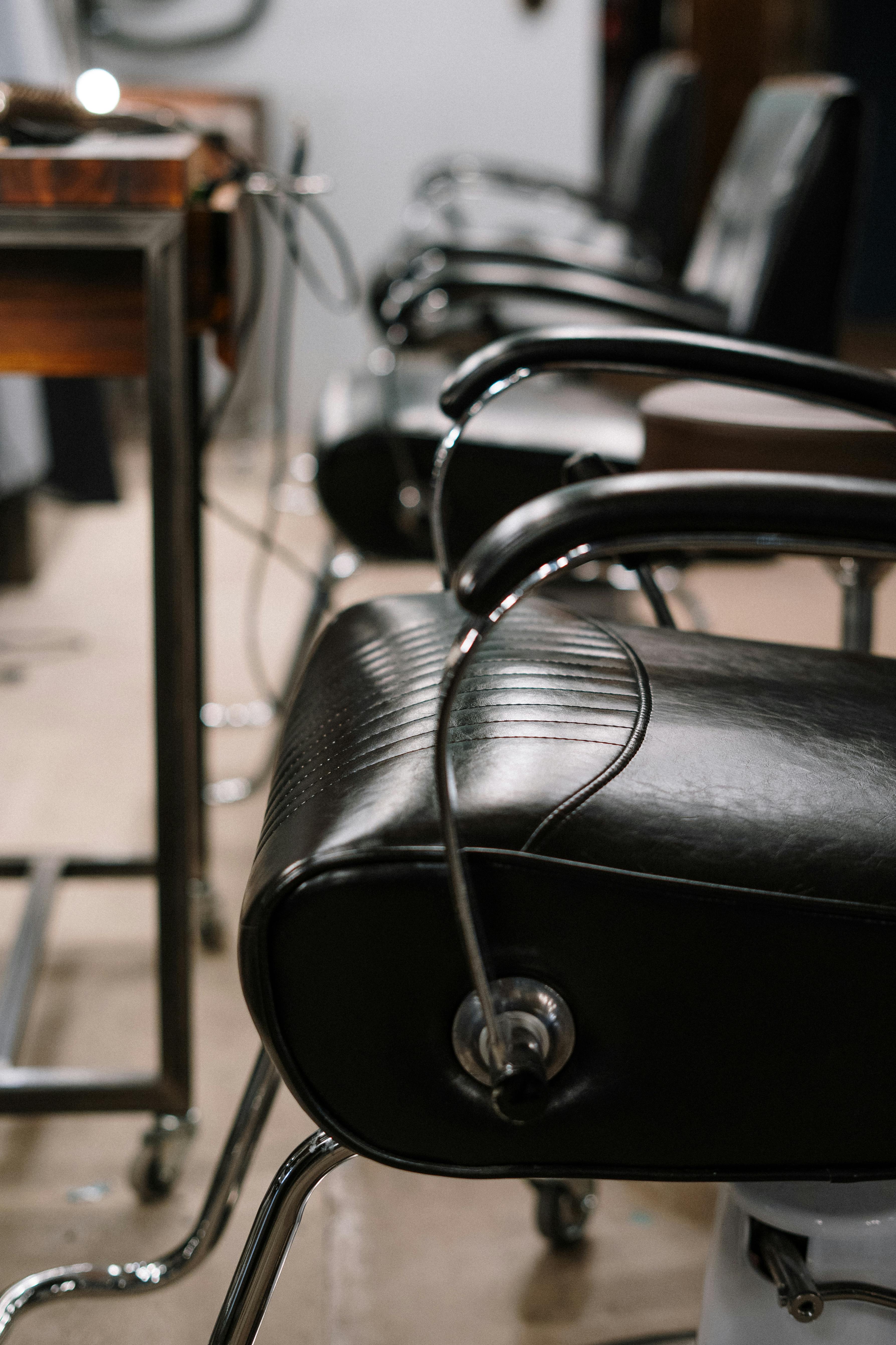 black leather padded stainless steel chair